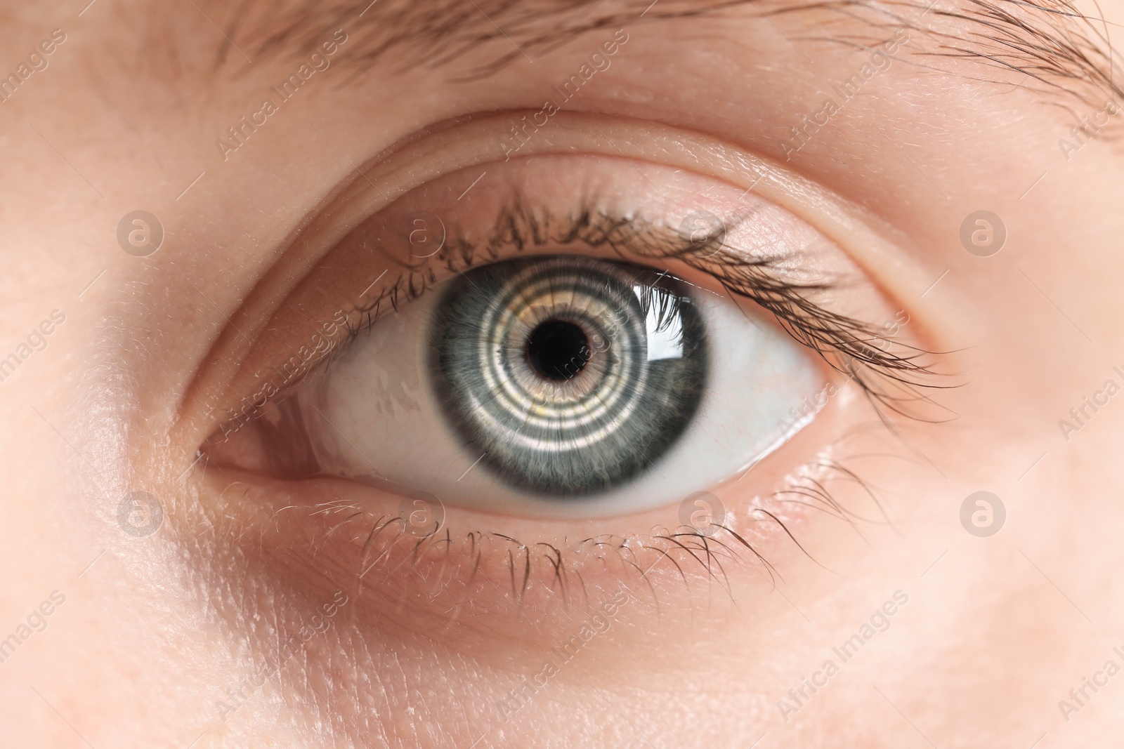 Image of Hypnosis. Spiral symbolizing hypnotic effect in woman's eye, closeup