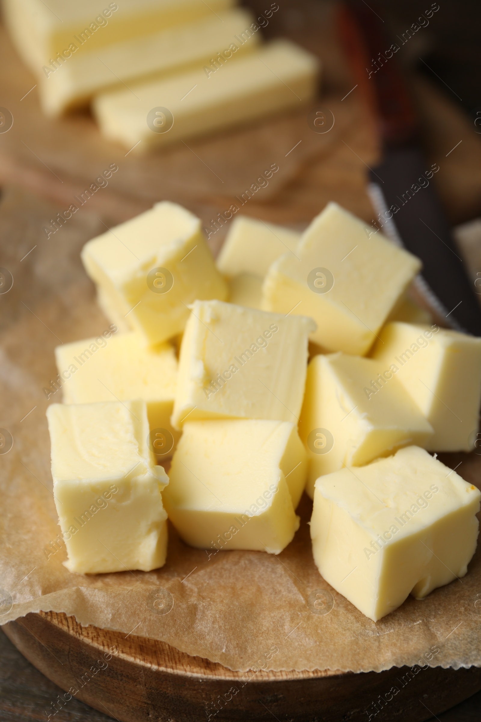 Photo of Pieces of fresh butter on table, closeup