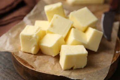 Photo of Pieces of fresh butter on table, closeup