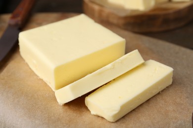 Pieces of fresh butter on table, closeup