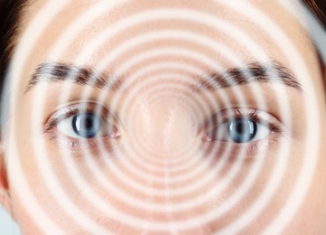 Image of Hypnotized woman, closeup. Spiral symbolizing hypnotic effect