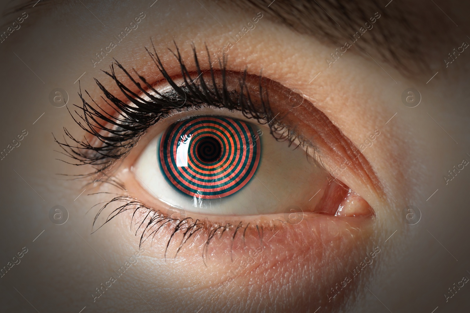 Image of Hypnosis. Spiral symbolizing hypnotic effect in woman's eye, closeup