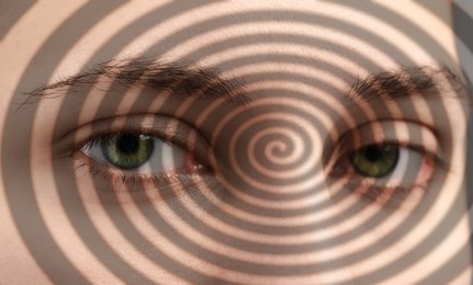 Image of Hypnotized woman, closeup. Spiral symbolizing hypnotic effect