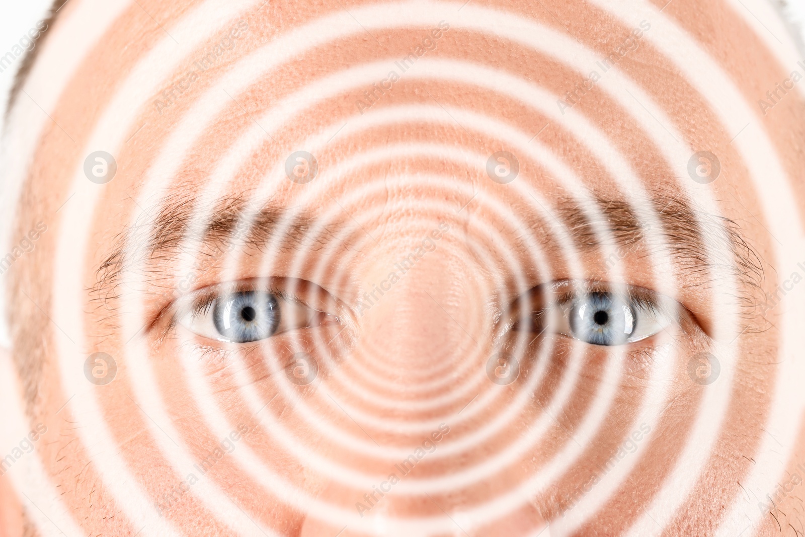 Image of Hypnotized man, closeup. Spiral symbolizing hypnotic effect