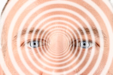 Image of Hypnotized man, closeup. Spiral symbolizing hypnotic effect