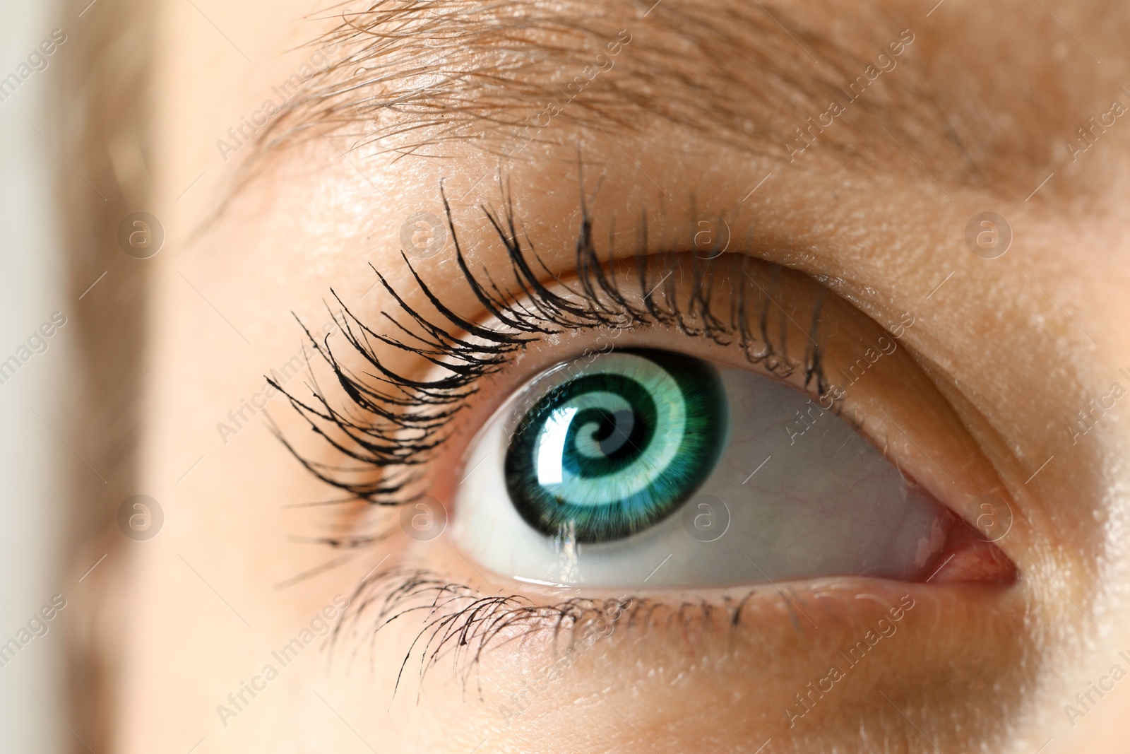 Image of Hypnosis. Spiral symbolizing hypnotic effect in woman's eye, closeup