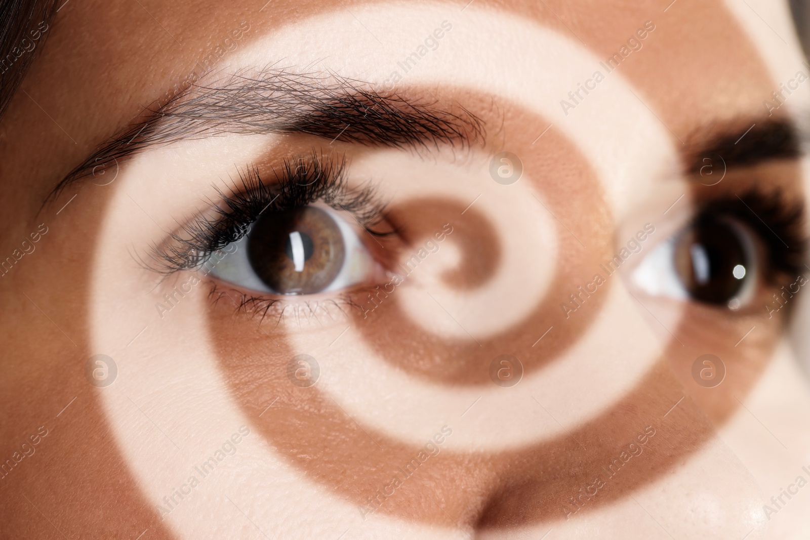 Image of Hypnotized woman, closeup. Spiral symbolizing hypnotic effect