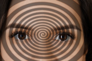 Image of Hypnotized woman, closeup. Spiral symbolizing hypnotic effect