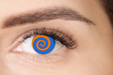 Image of Hypnosis. Spiral symbolizing hypnotic effect in woman's eye, closeup