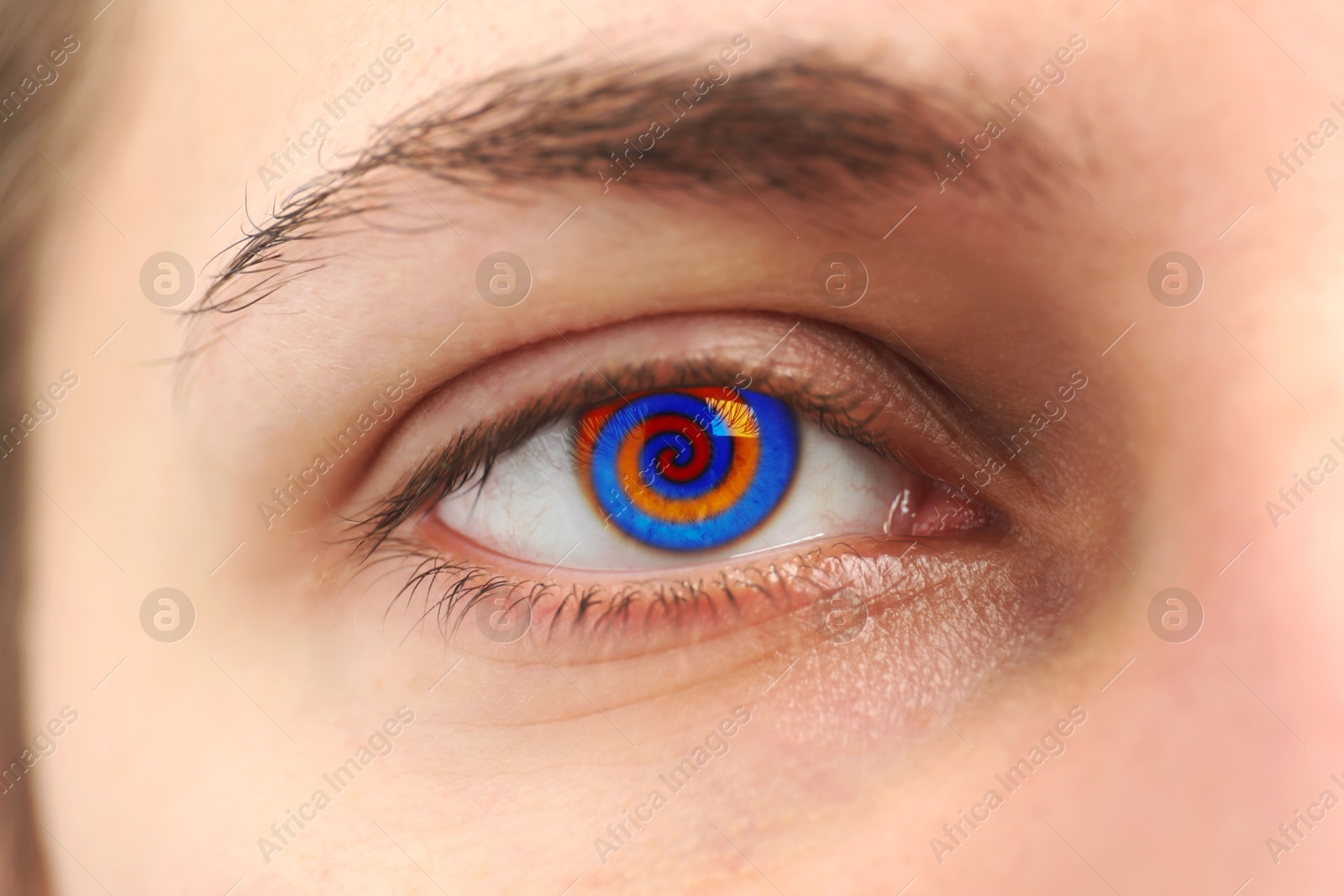 Image of Hypnosis. Spiral symbolizing hypnotic effect in woman's eye, closeup