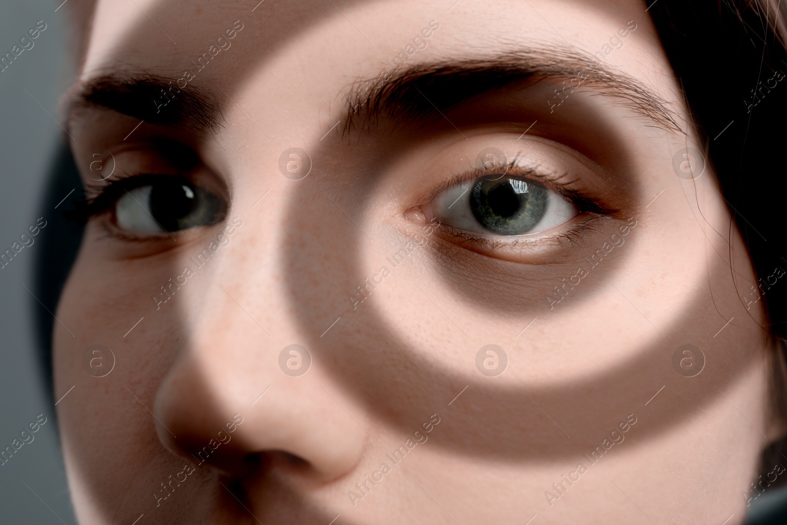 Image of Hypnosis. Spiral symbolizing hypnotic effect coming out of woman's eye, closeup