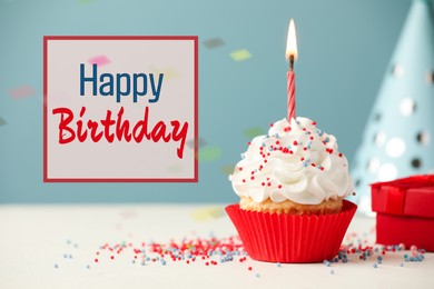 Image of Happy Birthday greeting card. Sweet cupcake with burning candle on table