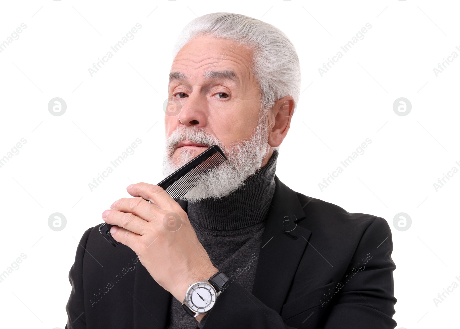 Photo of Senior man combing beard on white background