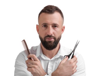 Photo of Bearded man holding comb and scissors on white background