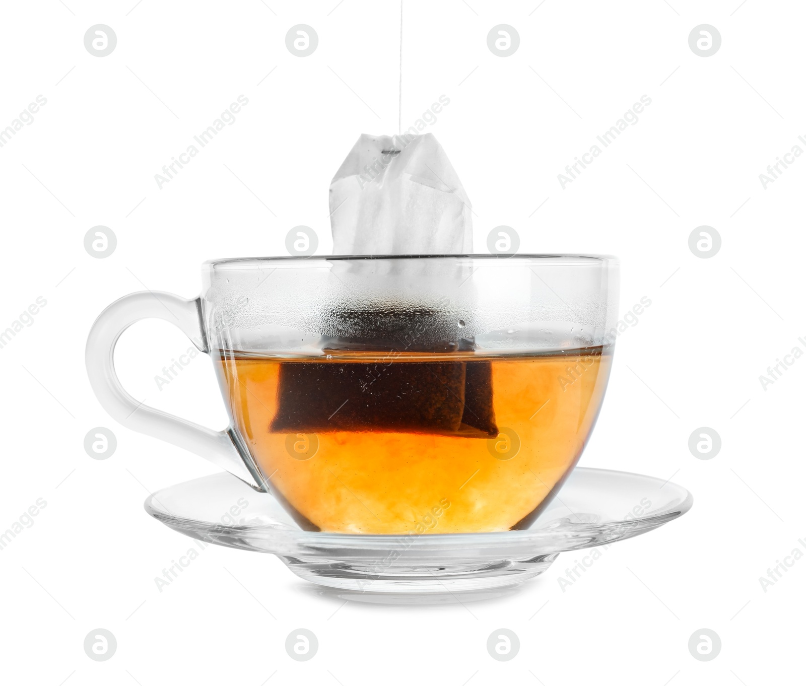 Photo of Cup with teabag isolated on white. Brewing aromatic tea