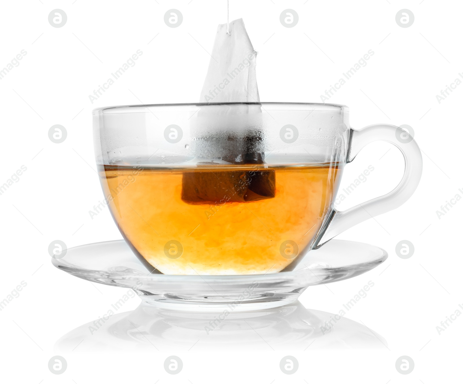 Photo of Cup with teabag isolated on white. Brewing aromatic tea