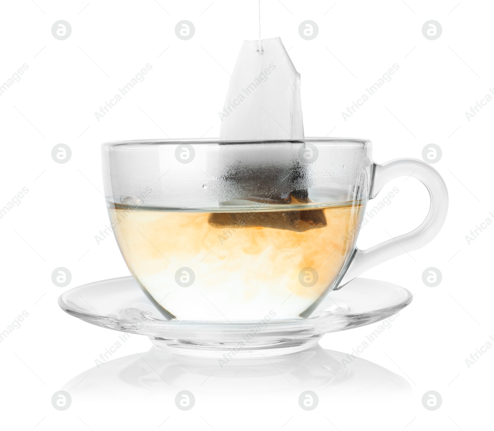 Photo of Cup with teabag isolated on white. Brewing aromatic tea