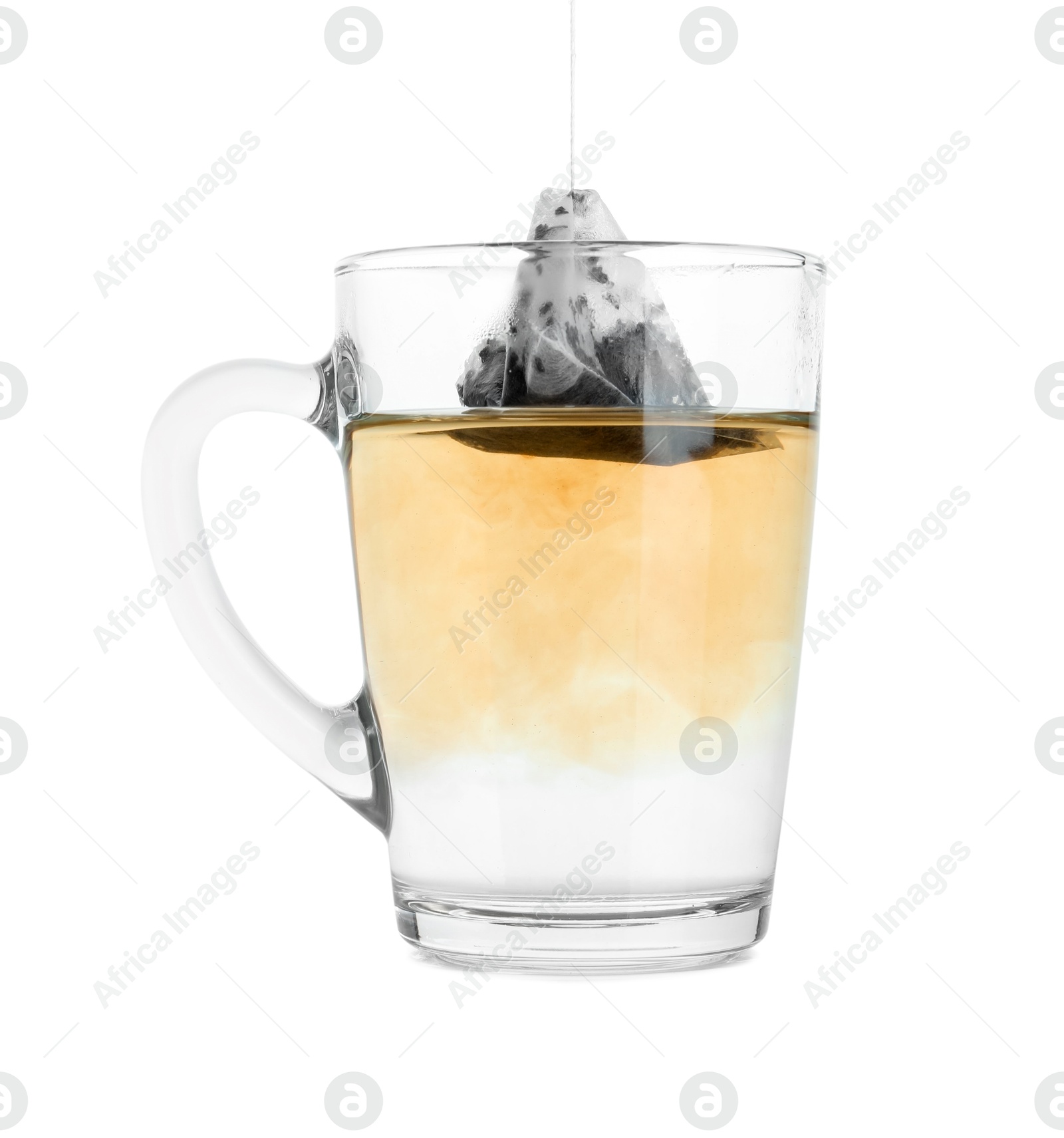 Photo of Brewing aromatic tea. Cup with teabag isolated on white