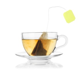 Photo of Brewing aromatic tea. Cup with teabag isolated on white