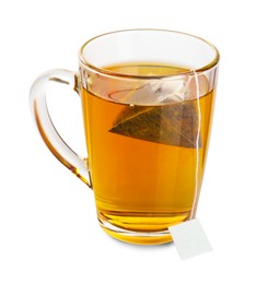 Photo of Tea bag in glass cup with hot drink isolated on white