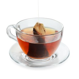 Photo of Putting tea bag into glass cup on white background