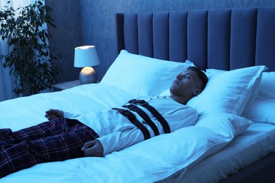 Photo of Sleepwalker fastened with belts lying on bed