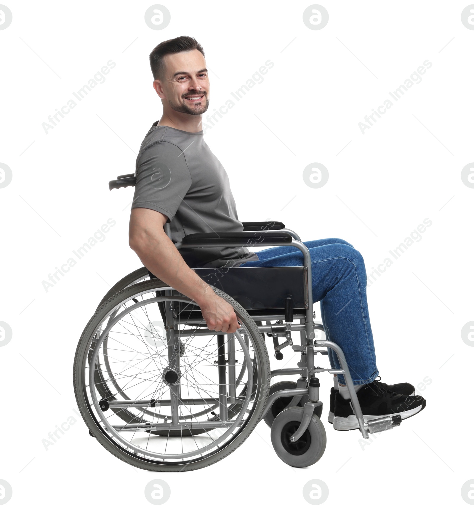 Photo of Smiling man in wheelchair on white background