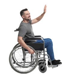 Photo of Man in wheelchair waving at someone on white background