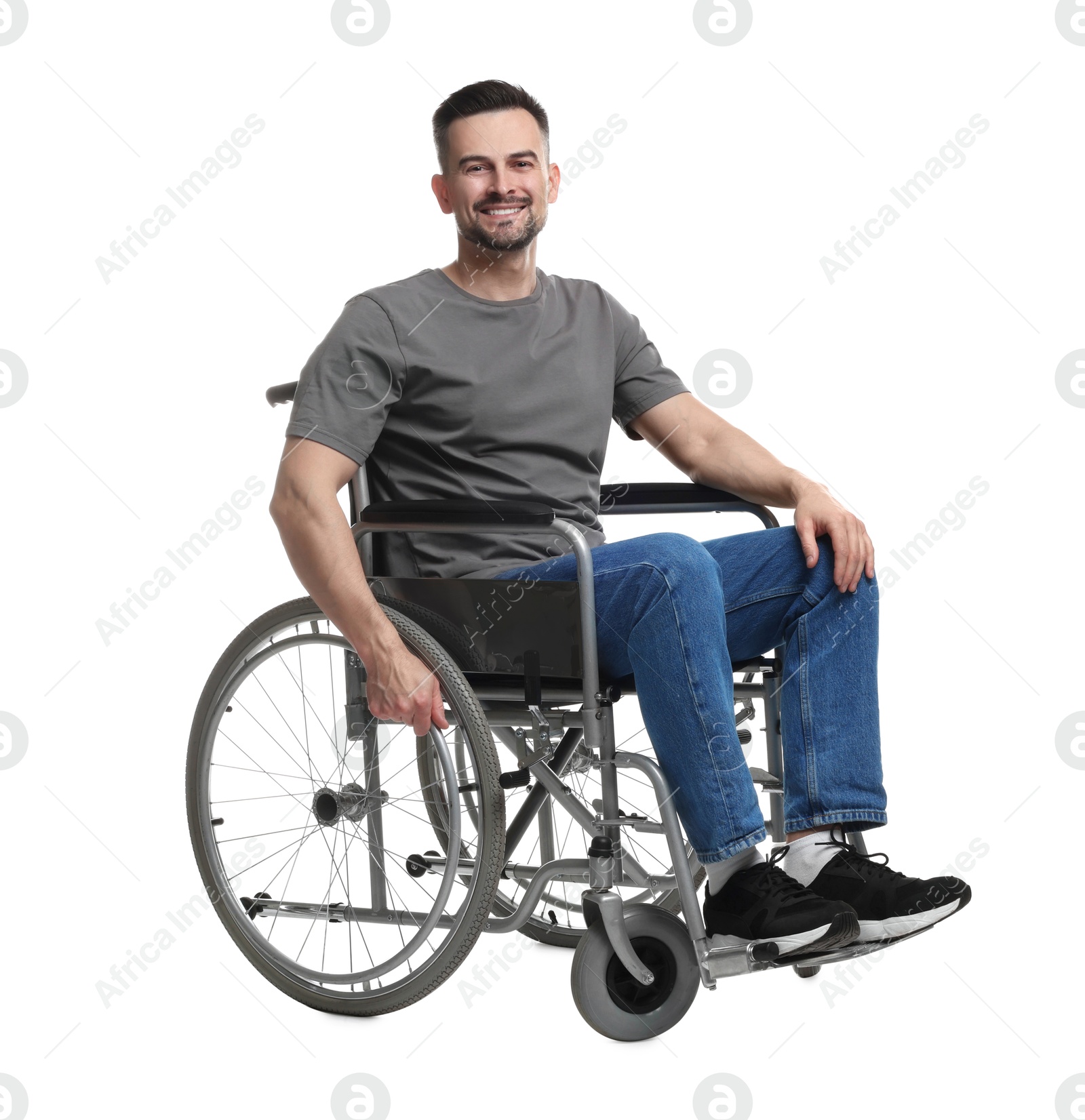 Photo of Smiling man in wheelchair on white background