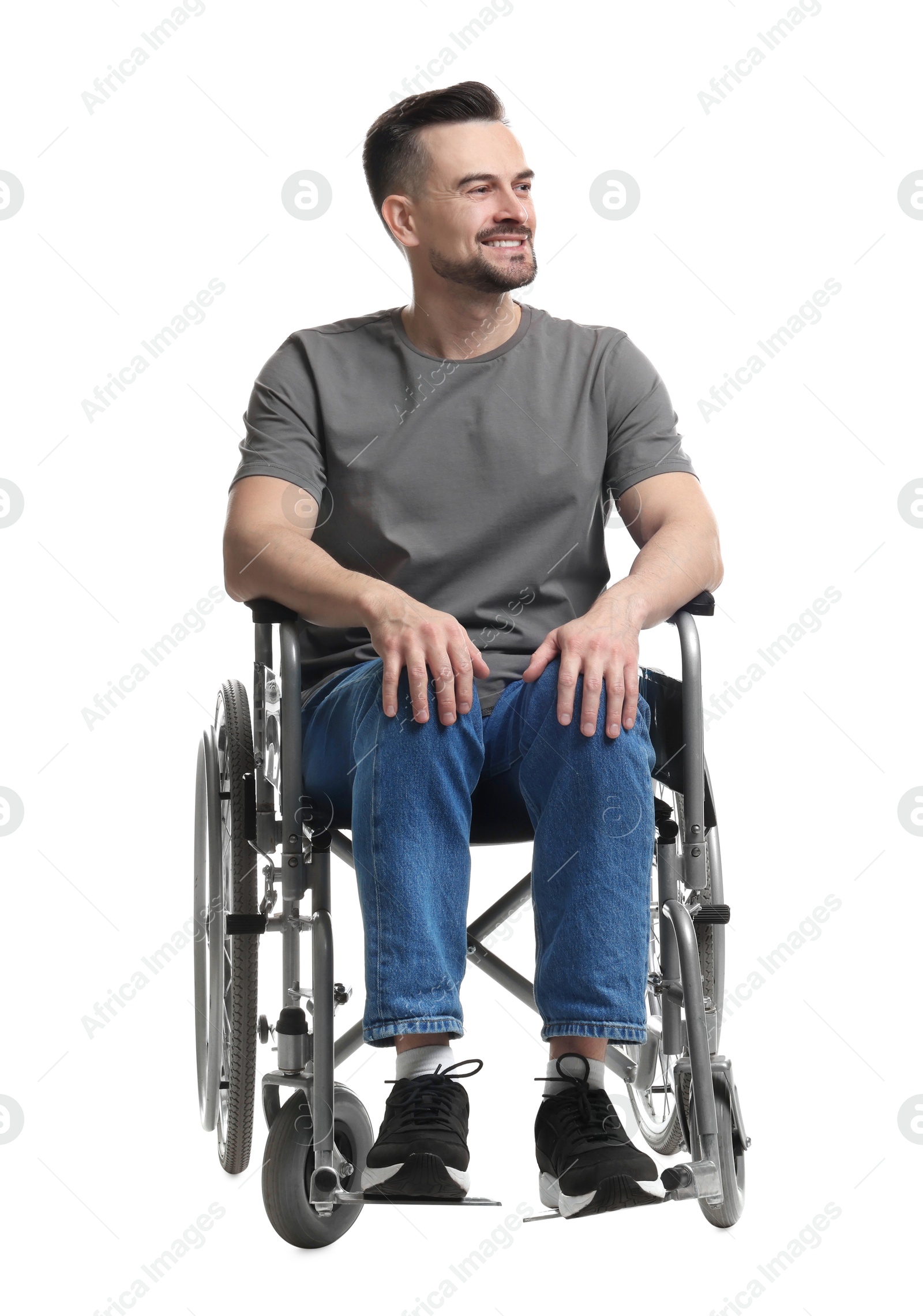 Photo of Smiling man in wheelchair on white background