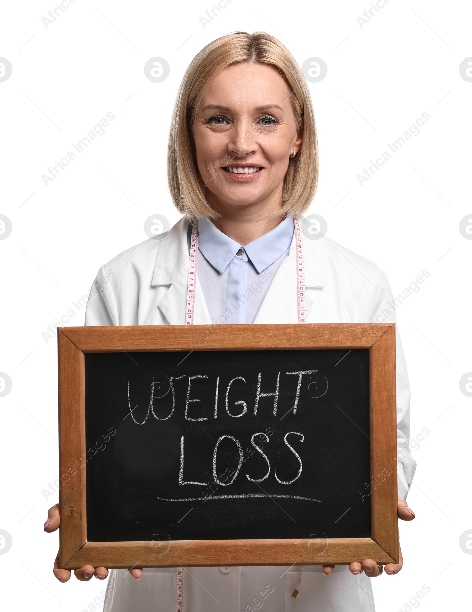 Photo of Happy nutritionist holding small blackboard with words Weight loss on white background