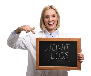 Photo of Happy nutritionist pointing at small blackboard with words Weight loss on white background