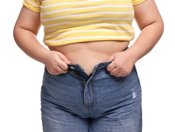 Photo of Weight loss. Plus size woman in big pants on white background, closeup