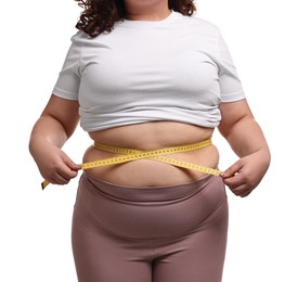 Photo of Weight loss. Plus size woman measuring waist with tape on white background, closeup