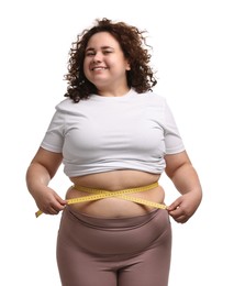 Photo of Weight loss. Happy plus size woman measuring waist with tape on white background