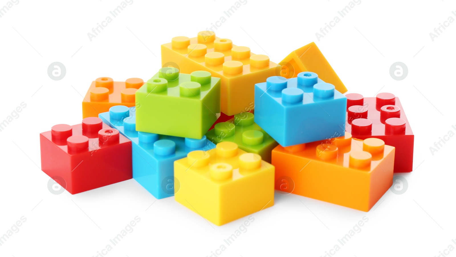 Photo of Construction toy. Pile of building bricks isolated on white