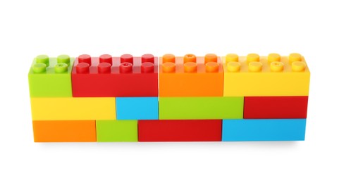 Photo of Construction toy. Figure made with building bricks isolated on white