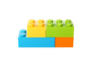 Photo of Construction toy. Figure made with building bricks isolated on white