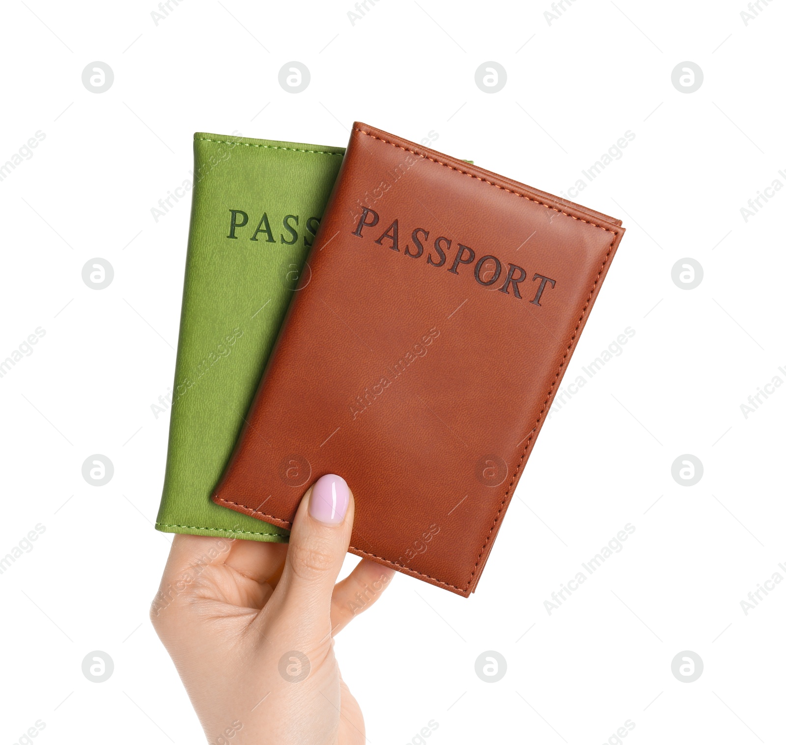 Photo of Woman holding passports in color covers on white background, closeup