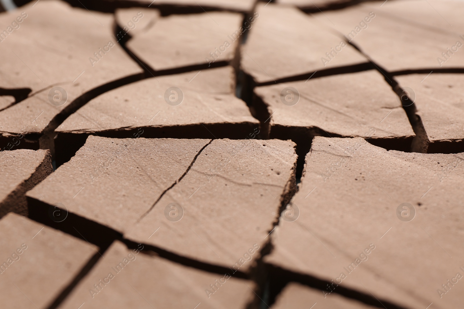 Photo of Dry cracked ground as background, closeup. Global warming