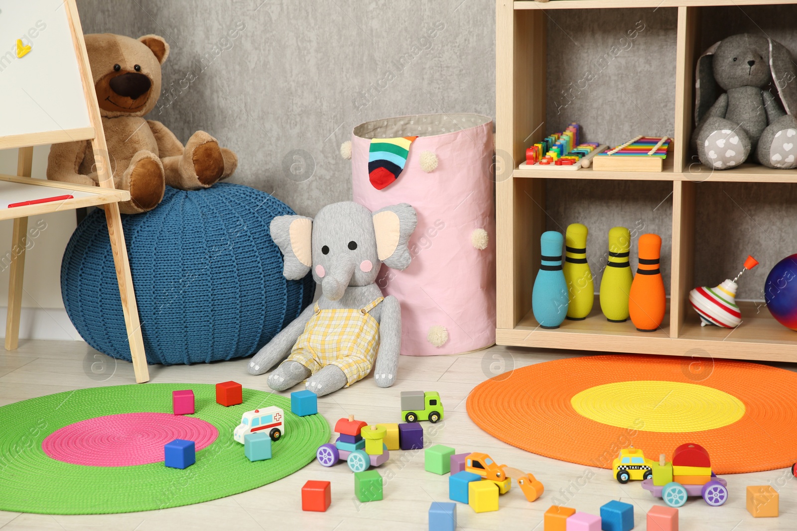 Photo of Beautiful kid's room interior with toys and stylish furniture