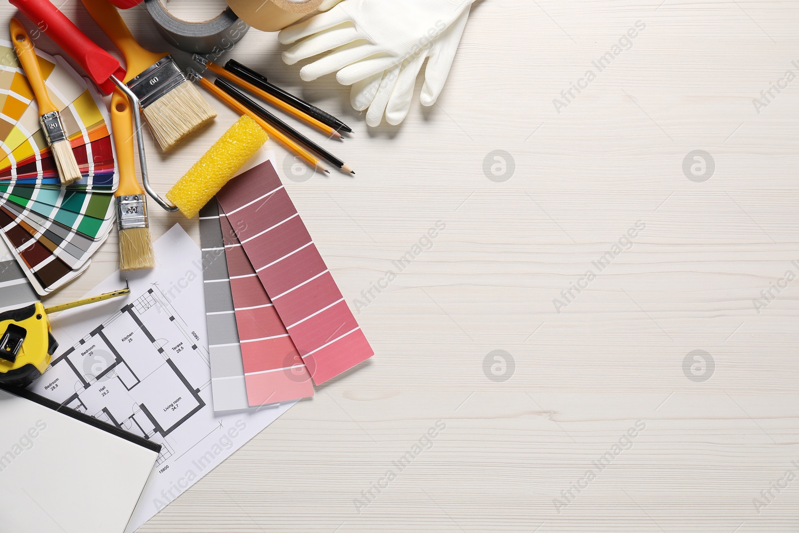 Photo of House plan and different decorator's tools on white wooden table, flat lay. Space for text