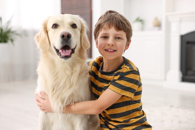 Boy with his cute dog at home