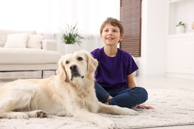 Boy with his cute dog at home