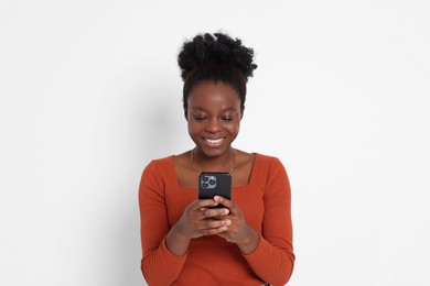 Photo of Happy woman with smartphone on white background