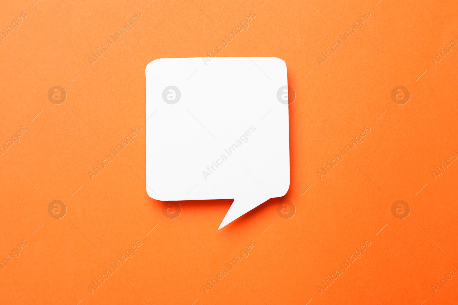 Photo of Blank speech bubble on orange background, top view. Space for text