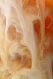 Photo of Refreshing coffee with ice and milk as background, closeup