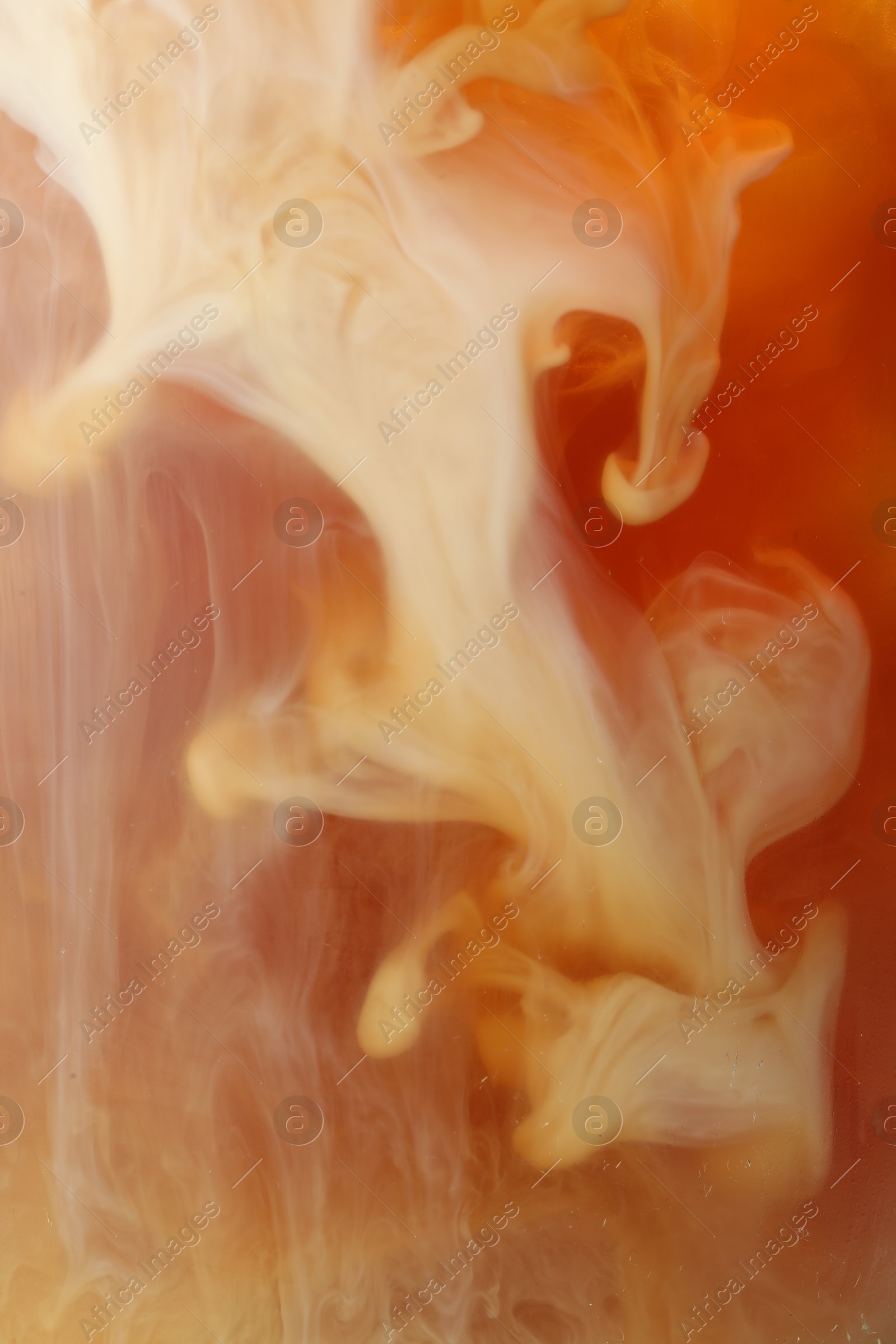 Photo of Refreshing coffee with ice and milk as background, closeup