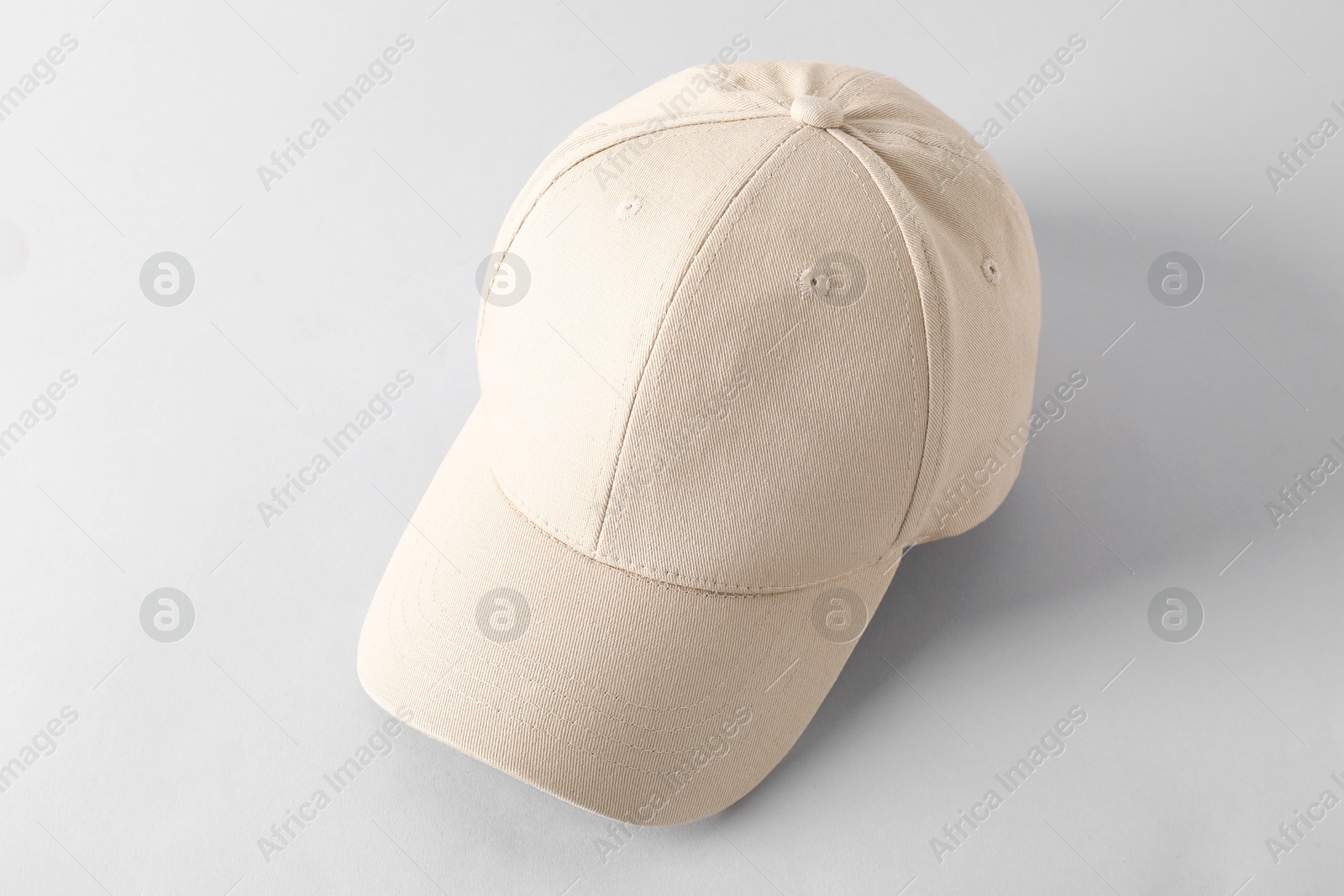 Photo of Stylish baseball cap on light grey background. Mockup for design