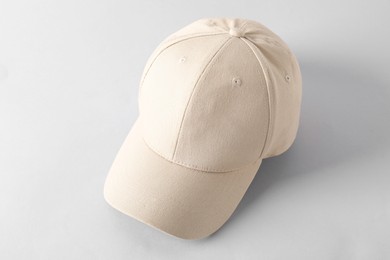 Photo of Stylish baseball cap on light grey background. Mockup for design